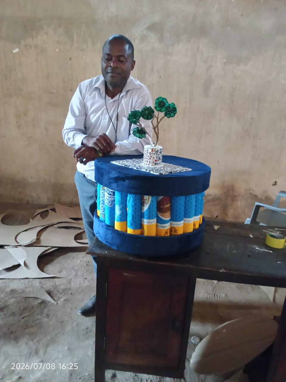 Members of an enterprise group with their cookstove products